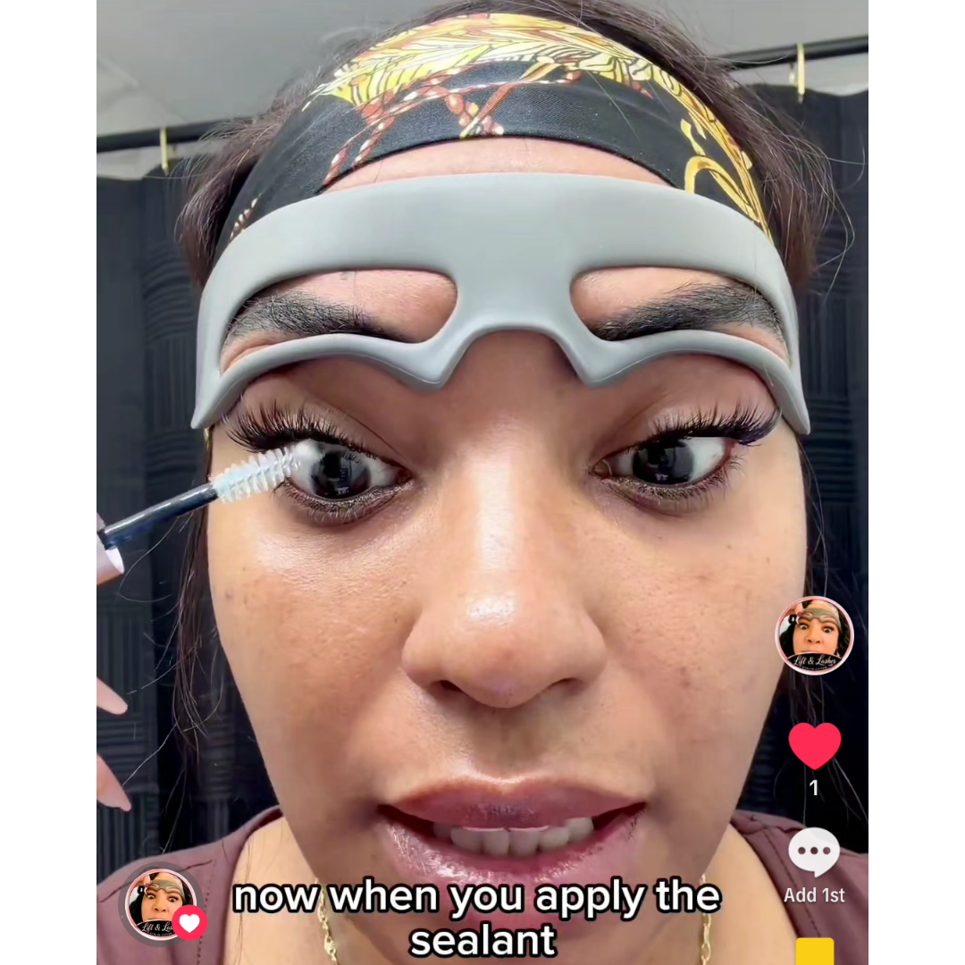 A close-up of a person applying false eyelashes with a spoolie, wearing a gray protective eye mask and a patterned headband. Text overlays mention 'Lift and Lashes' and 'eyelash Lifting Serum'.